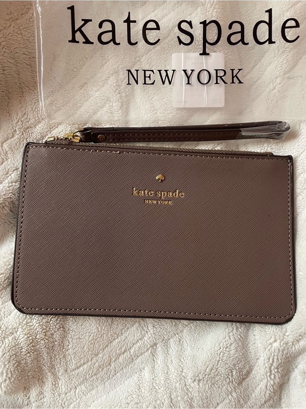 kate spade taupe logo wristlet pouch with gold hardware